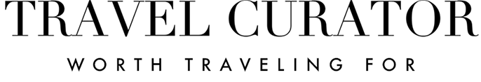 Travel Curator logo, black text on white background.