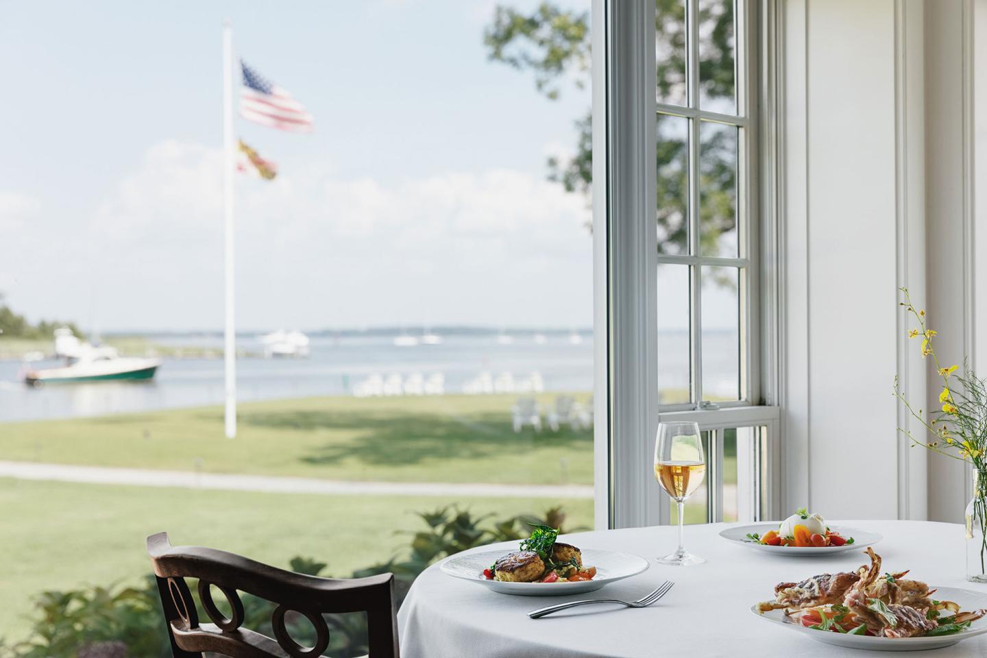 Dining table set looking out of grass and the ocean