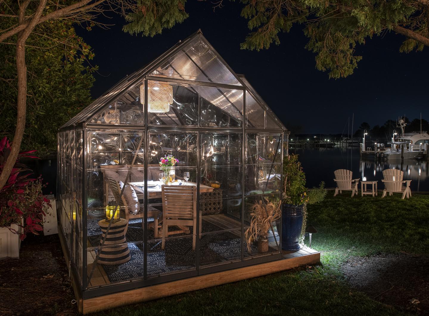 Dining setting inside a small greenhouse