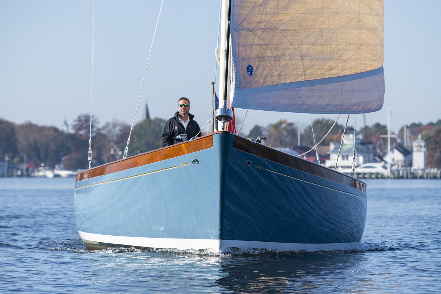 Man cruising a sailing boat