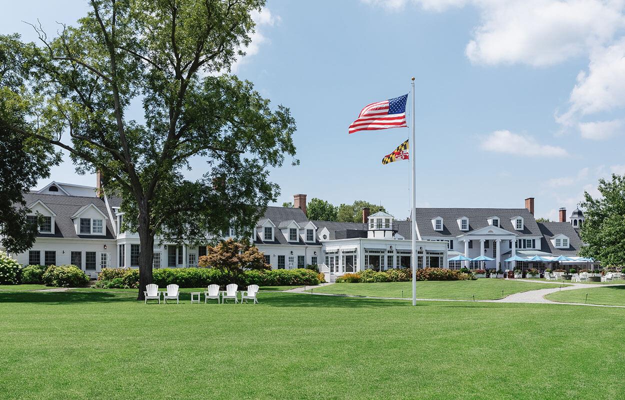 American flag full mast on the lawn in front of Inn at Perry Cabin