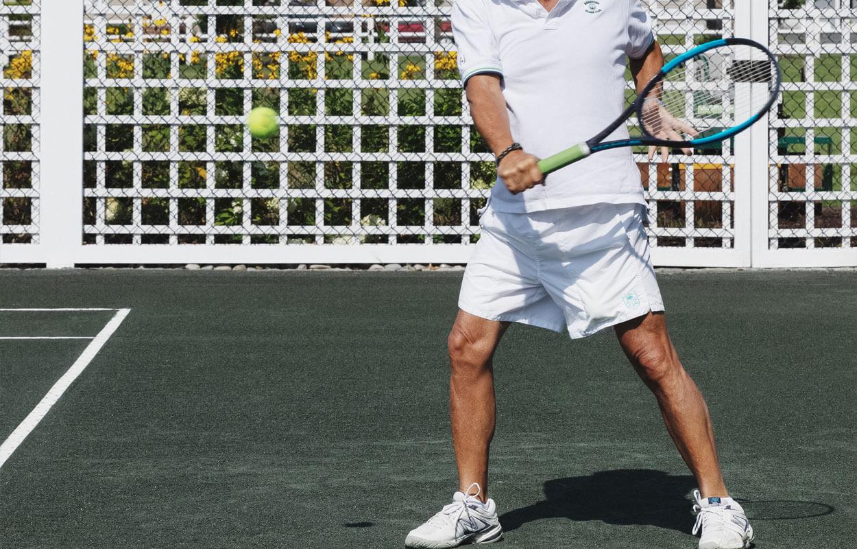 Tennis player taking a swing