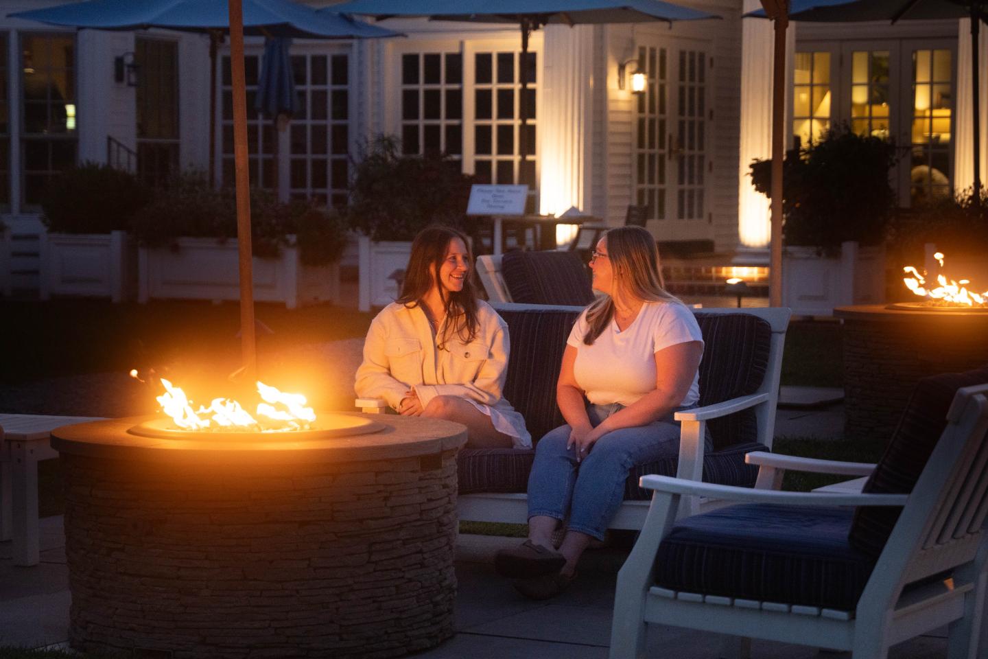 Friends at firepits during dusk