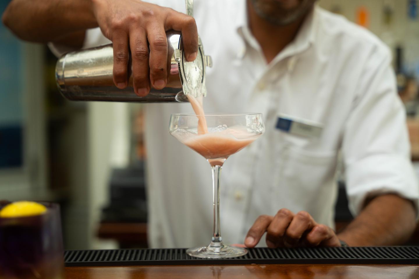 Bartender pouring summer refreshment in Purser's Pub