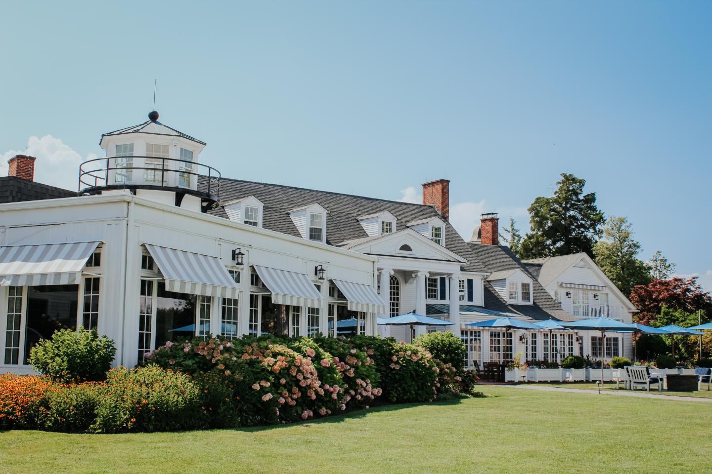 Waterside view of STARS restaurant and the manor house