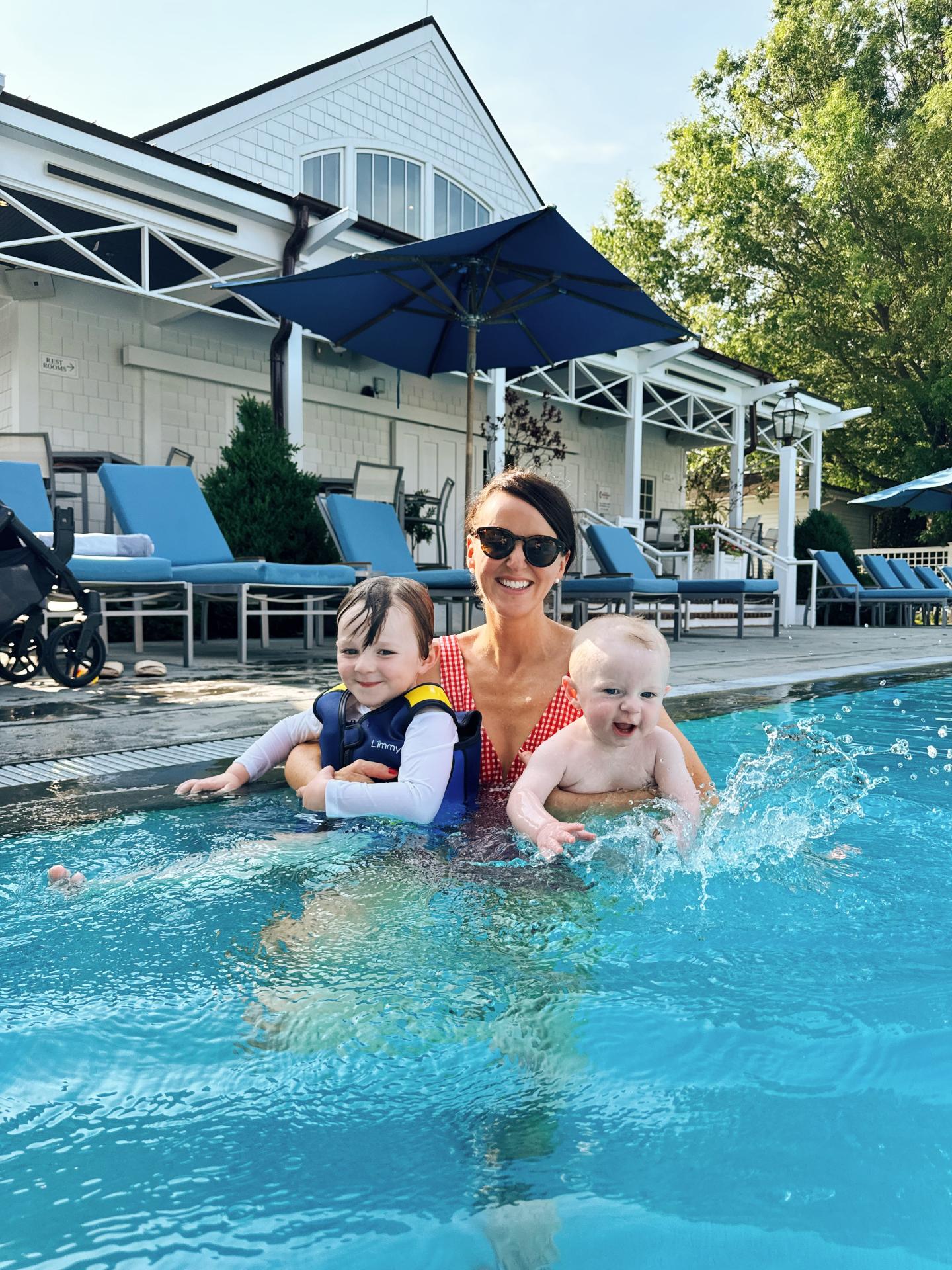 Mom and children having fun in the pool