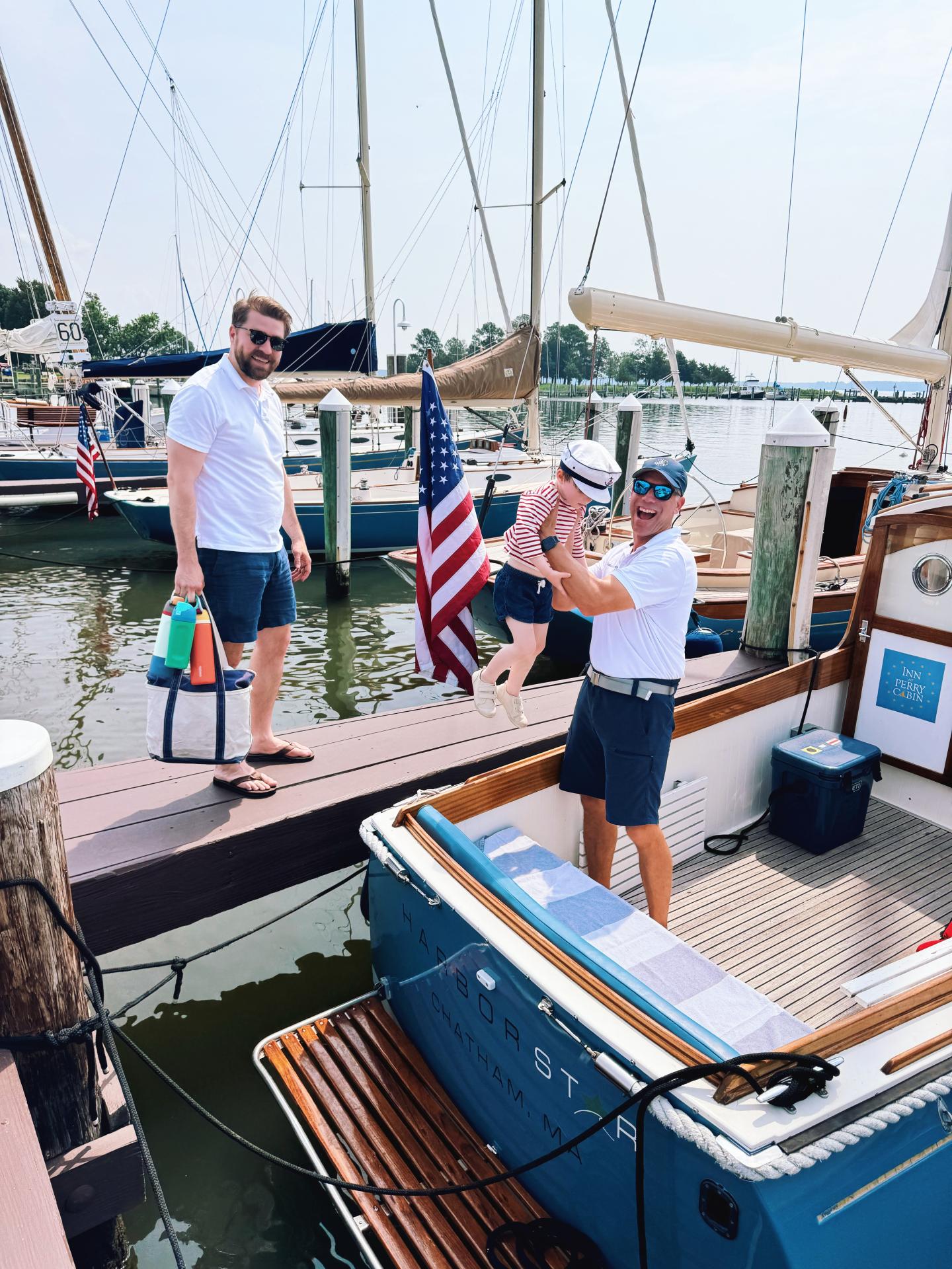 Dad and son being assisted into the French Canal commuter by Captain