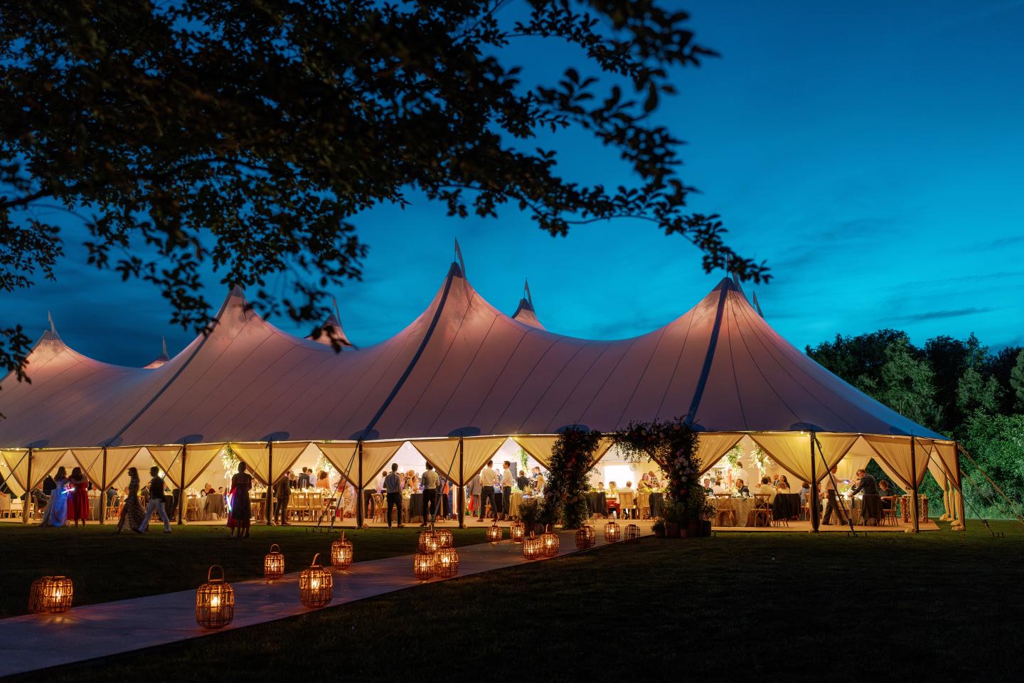 Reception tent on Linden Lawn at dusk