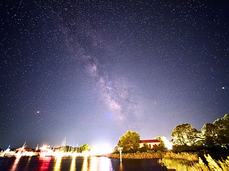 Night sky filled with stars over the waterfront at the Inn