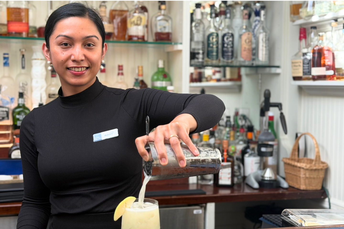 Bartender pouring drink in Purser's Pub