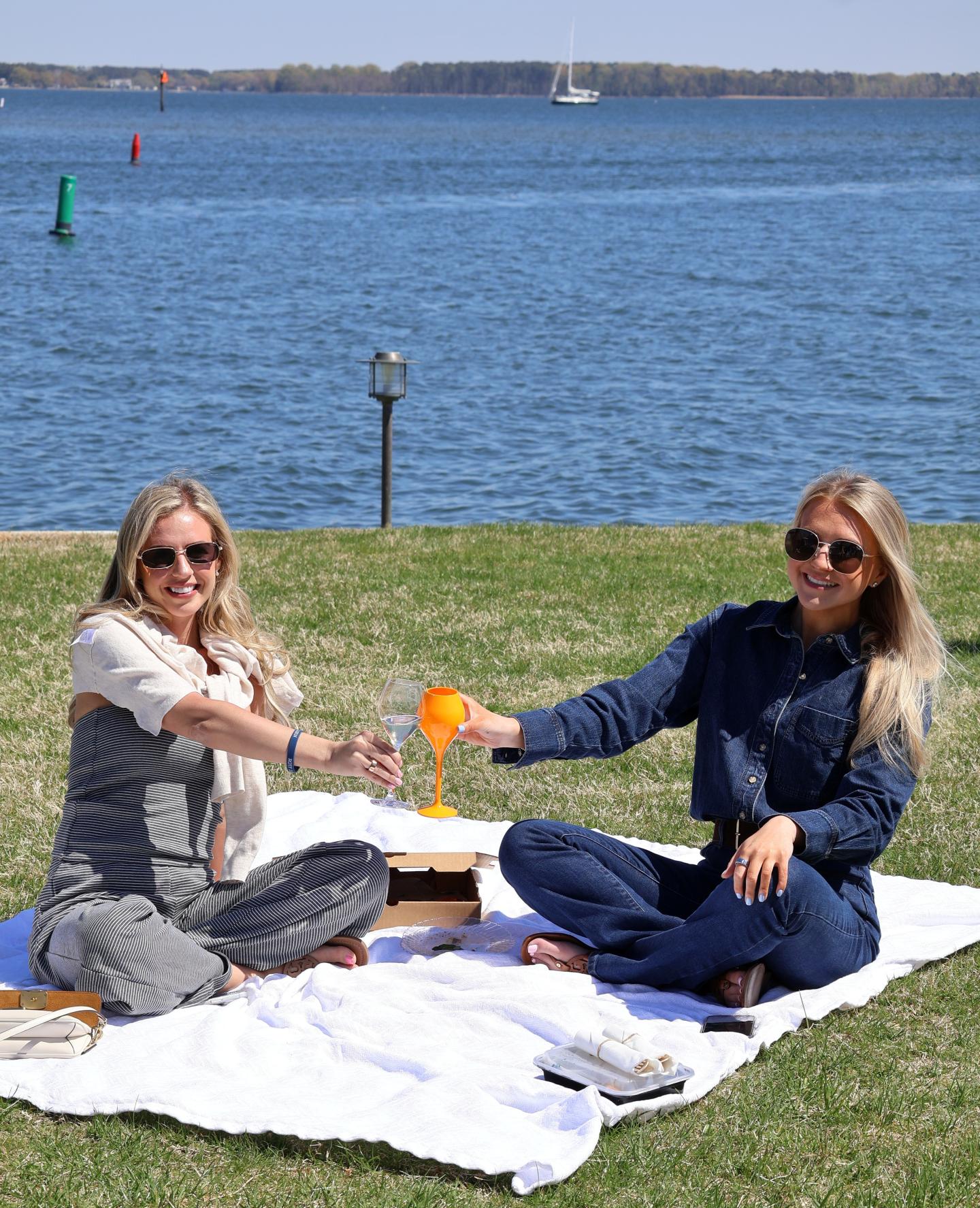 Guests enjoying fire brick oven pizza and champagne on The Pointe
