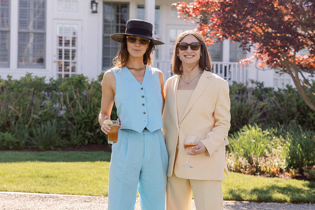Two women in suits on the Manor Lawn