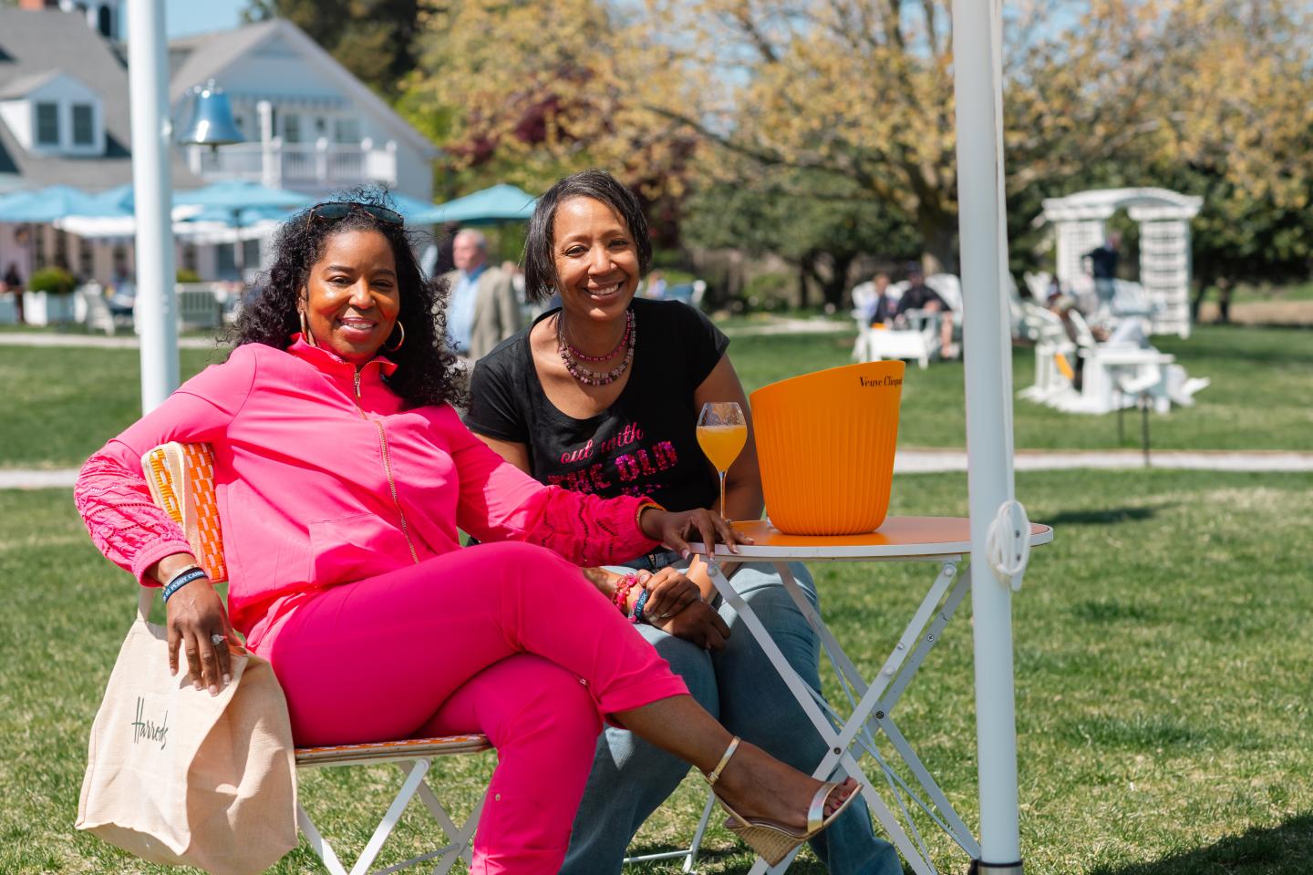 Guests on The Pointe waterfront lawn