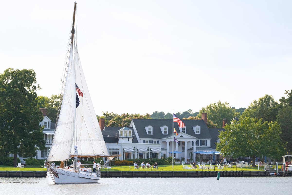 Stanley Norman Skipjack sailing in front of Inn at Perry Cabin