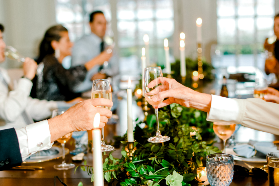 Guests making toast in Miles Room during intimate gathering