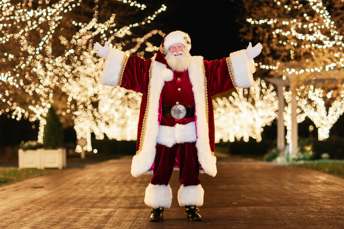 Santa Claus lighting the lane in front of Inn at Perry Cabin